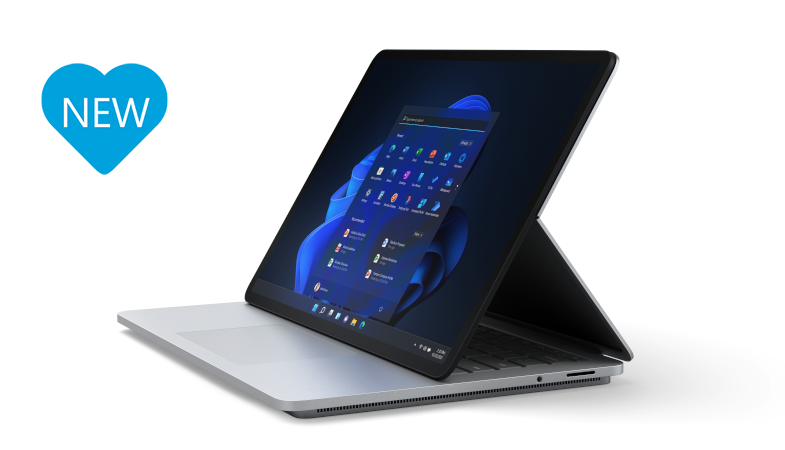 A total view of the Surface Laptop Studio in stage mode with a blue heart that says NEW on the left next to the Surface device 