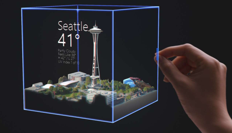 A small hologram of the HoloLens 2 shows information about Seattle