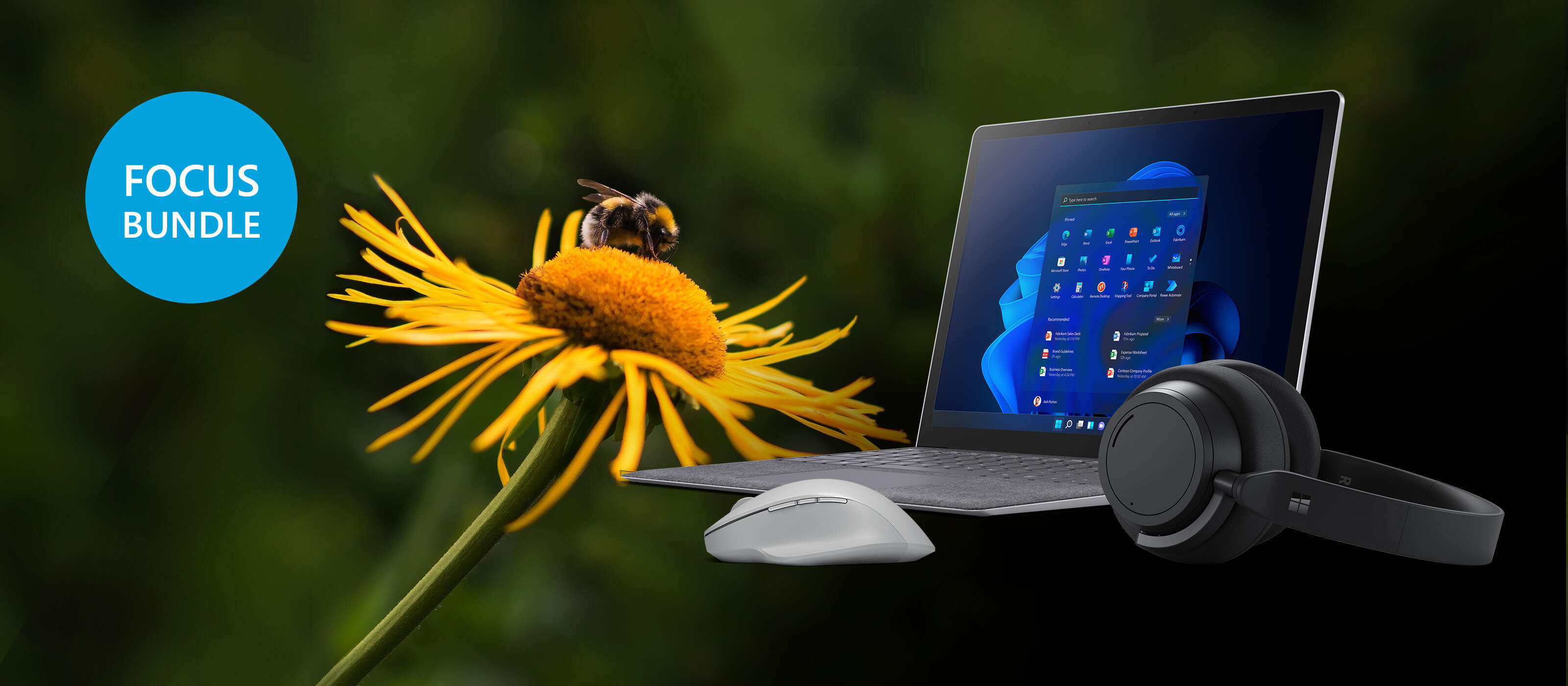 The Surface Laptop 4 is placed in front of a flower with a bumblebee on it
