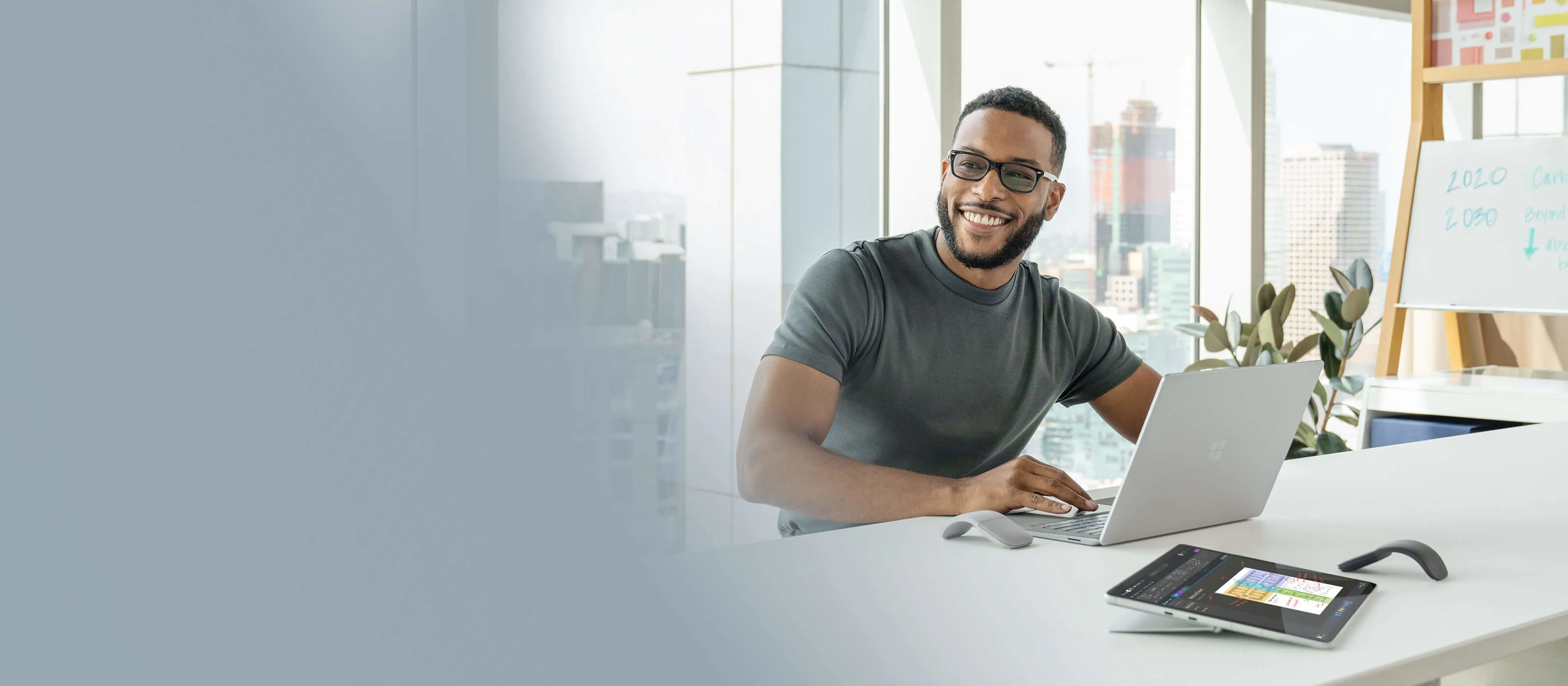 A man working on a Surface Laptop 5