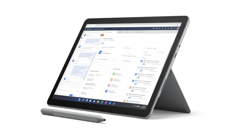 A Surface Pen in platinum is placed in front of the Surface Go 3 with the Kickstand open