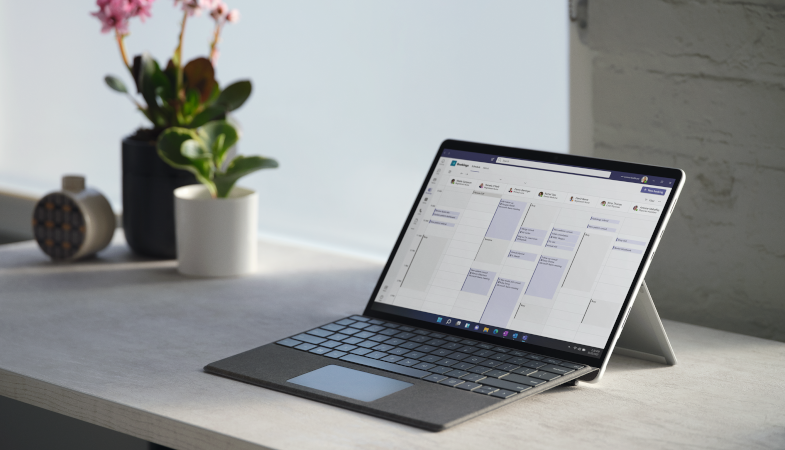 Surface Pro Signature Type Cover in Platinum with a Surface Pro 8 folded up in laptop mode 