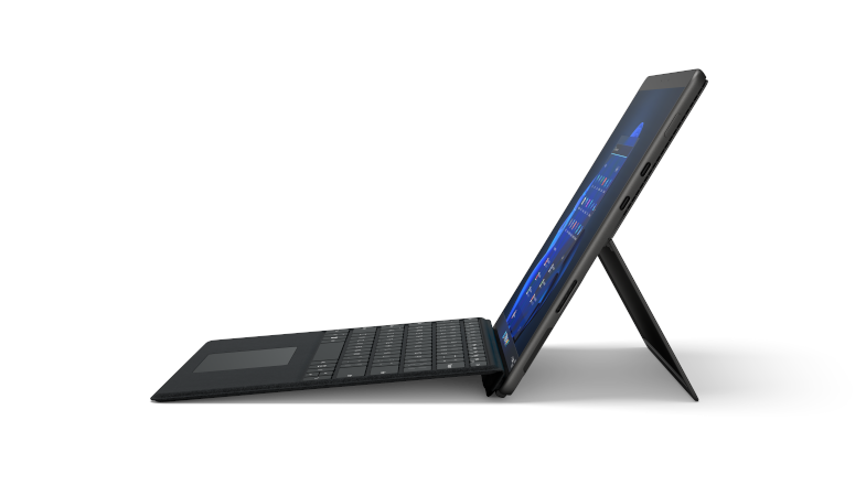 The Surface Pro 8 in graphite with the Surface Pro Signature Keyboard in black from a lateral perspective