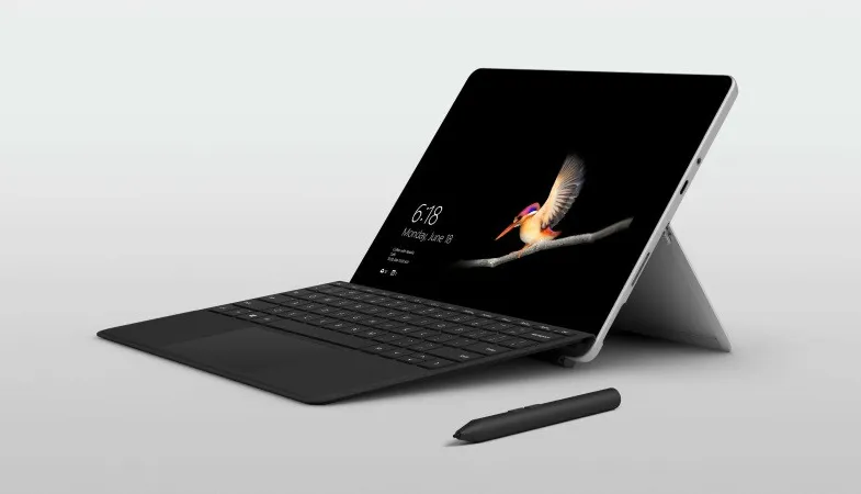 The Classroom Pen next to a Surface Go with the black Type Cover