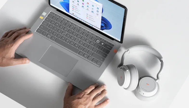 Bird's eye view of a Surface Laptop Go and Surface Headphones stickered with the products from the Surface Adaptive Kit