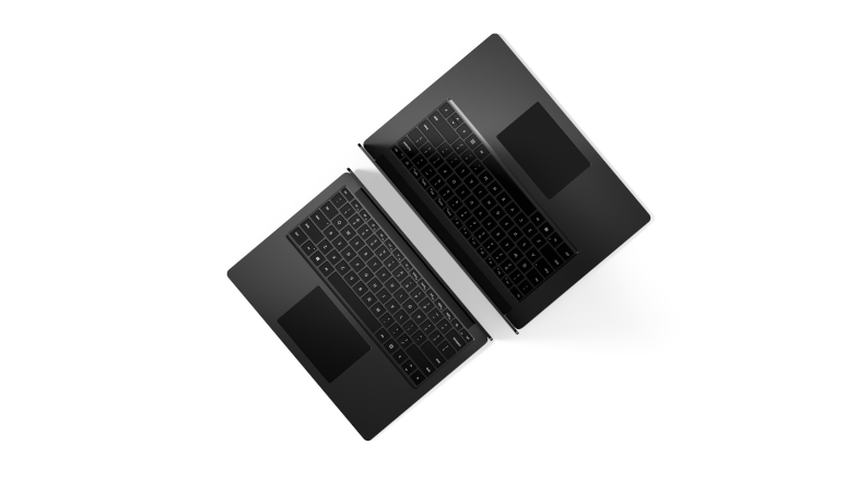A top view of two Surface Laptop 4 in matte black in two different sizes with their backs turned towards each other