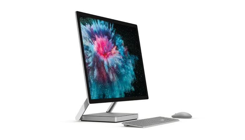 The Surface Studio 2 from a lateral perspective with keyboard and mouse