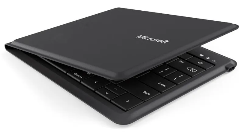 The Microsoft Universal Foldable Keyboard is shown half-folded from a side perspective 