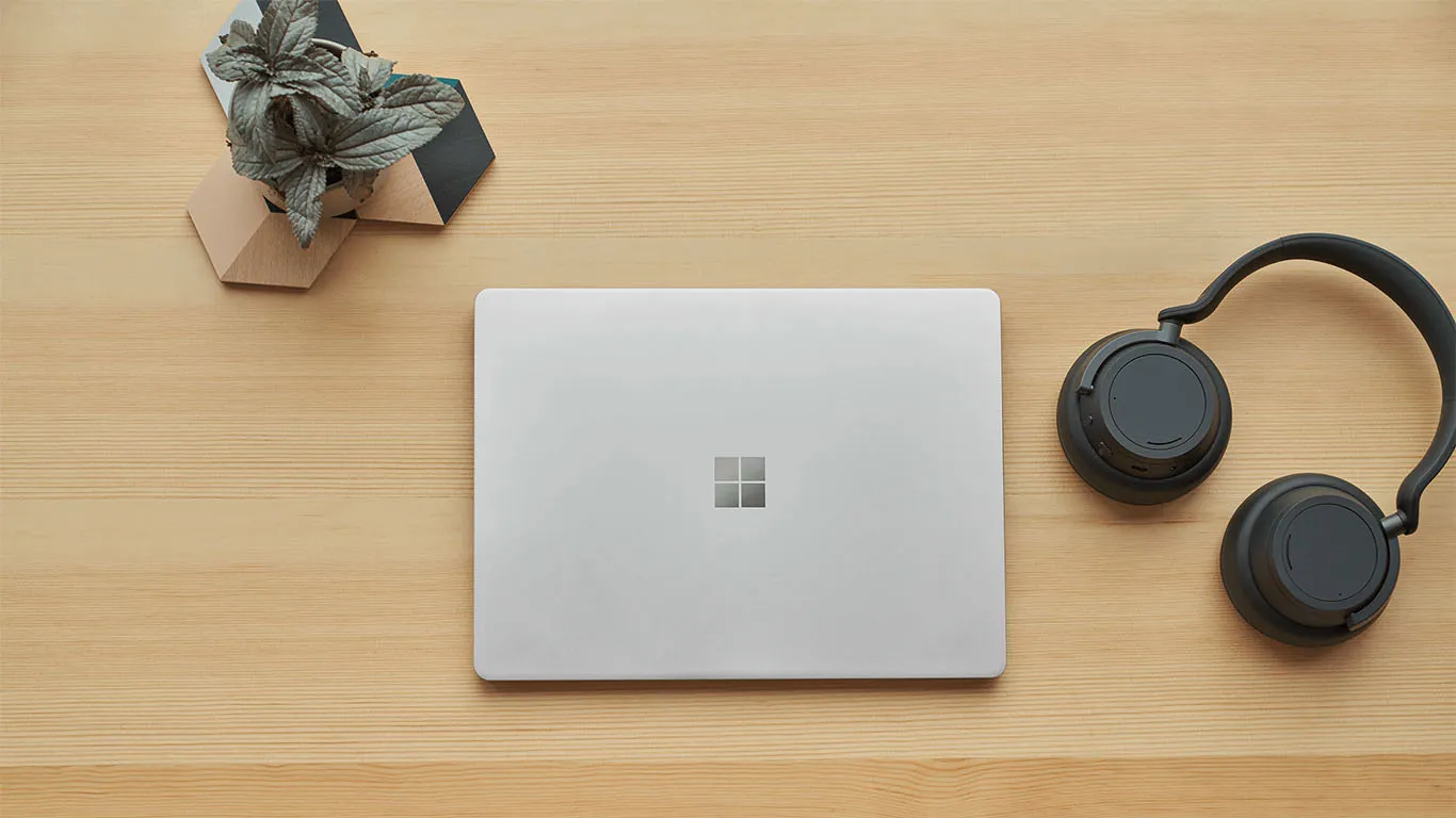 Surface Laptop Go 2 with high Windows security standards Bird's eye view of an ice blue Surface Laptop Go 2 on a desk