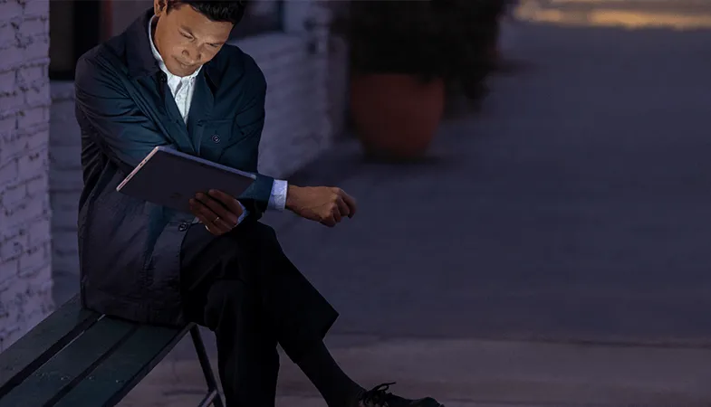 Microsoft Surface USB-C® Travel Hub mobile workplace A man is working on the go with his Surface Go